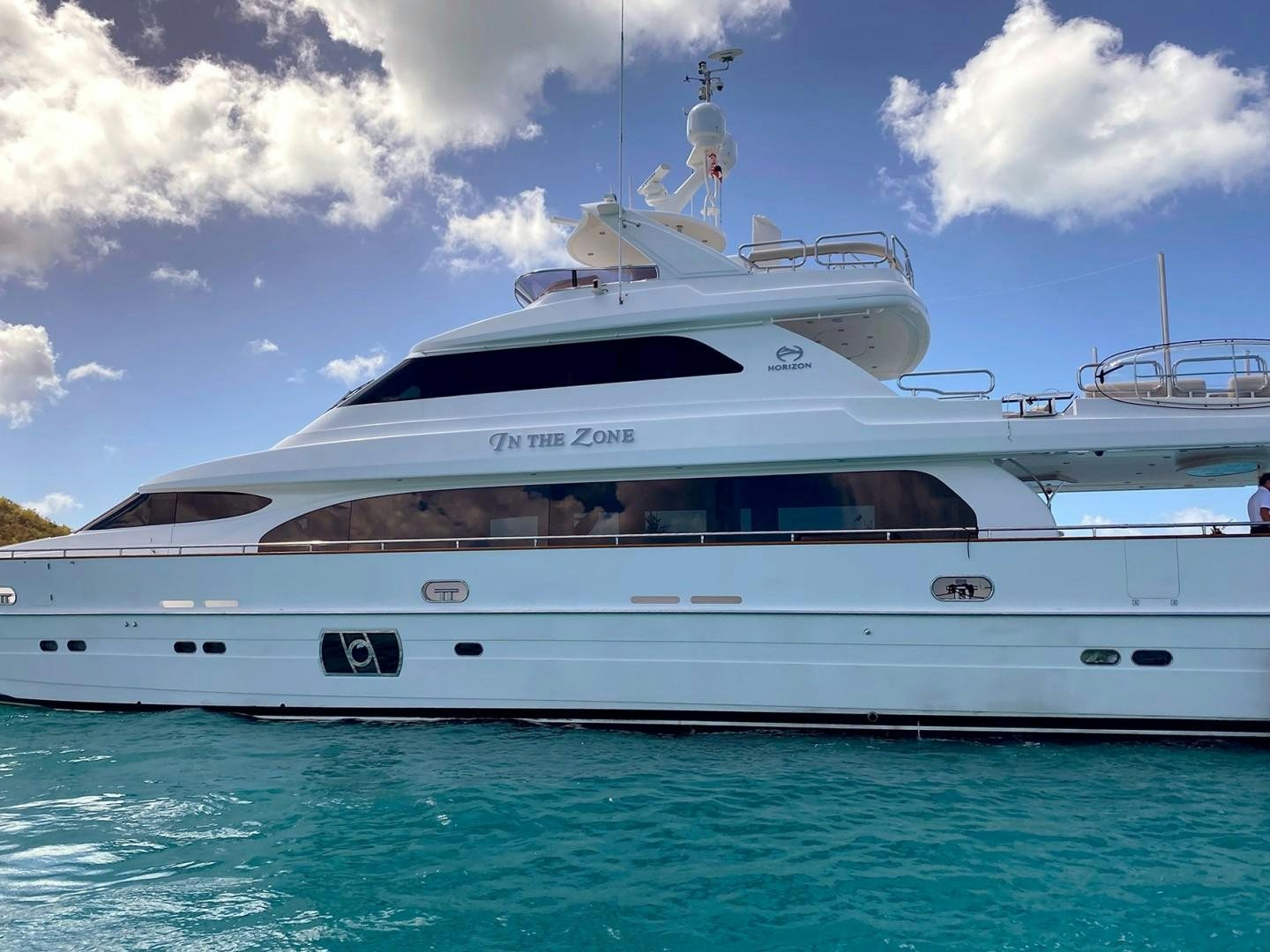 a white yacht in the water aboard IN THE ZONE Yacht for Sale