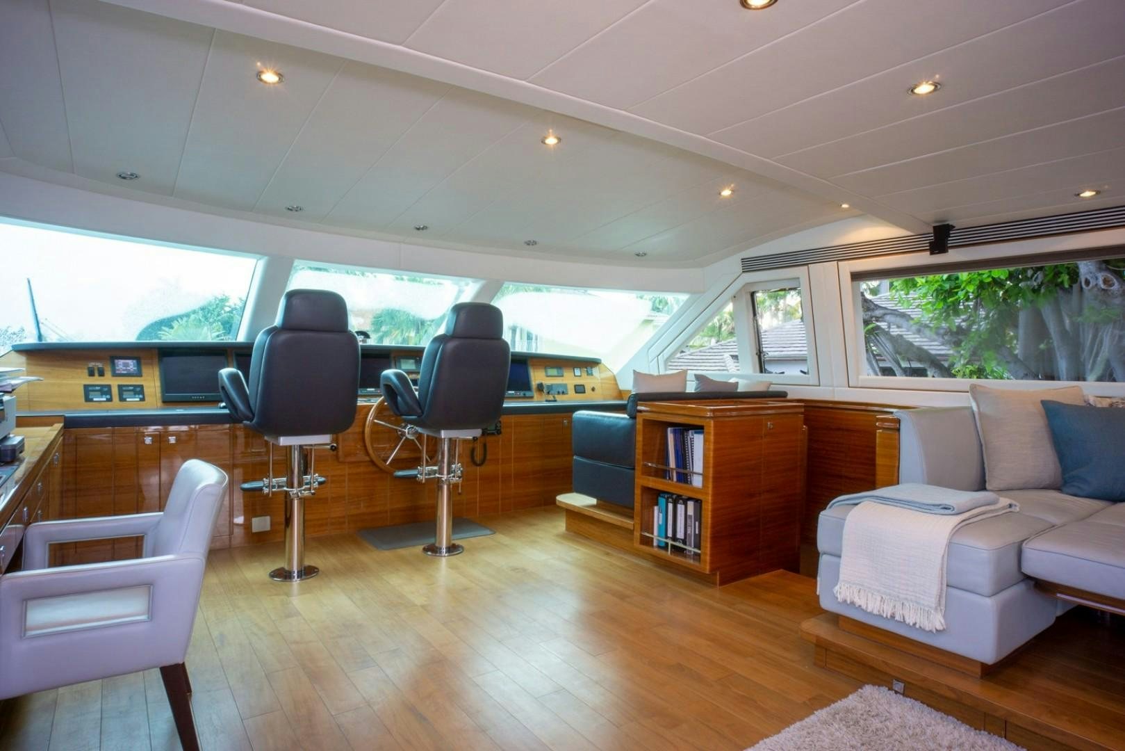 a room with a couch and a table and chairs aboard IN THE ZONE Yacht for Sale