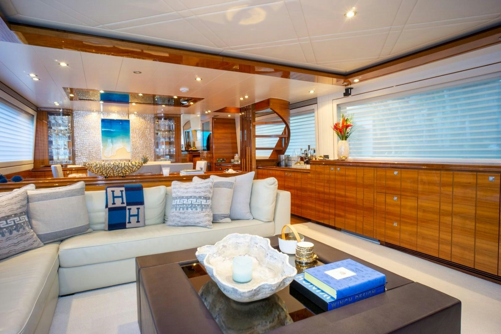 a living room with a couch and a coffee table aboard IN THE ZONE Yacht for Sale