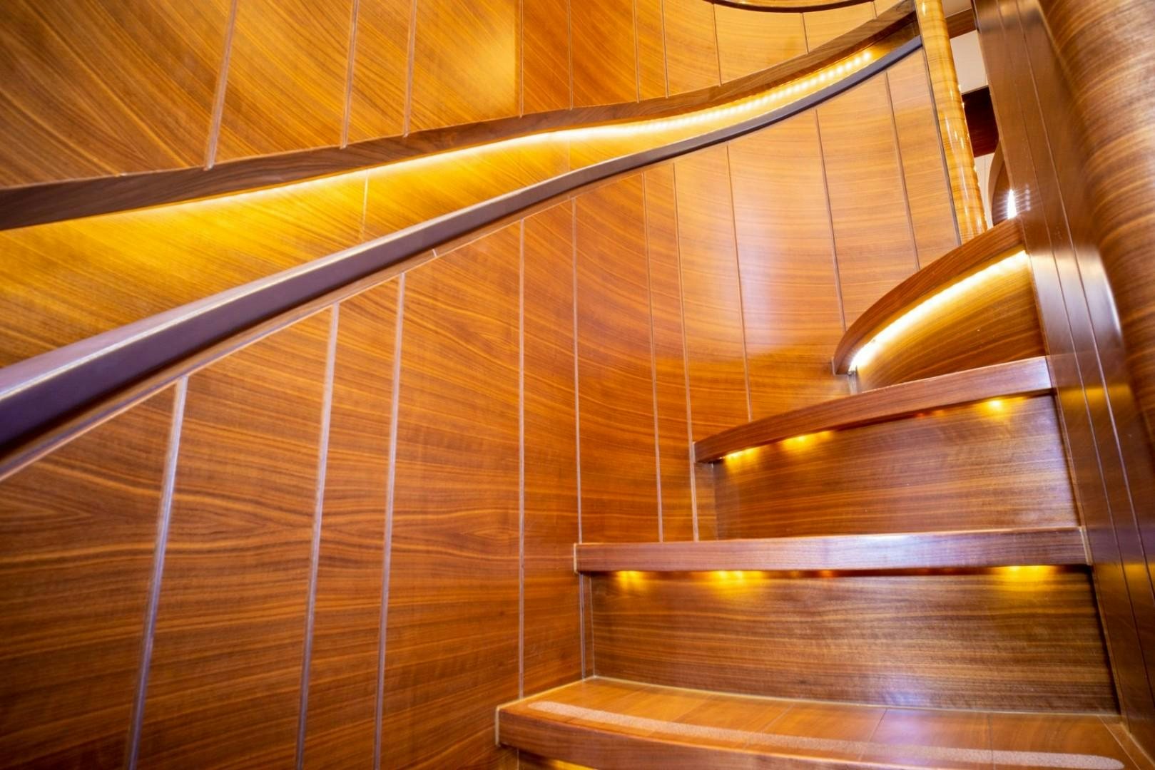 a wooden staircase with a light aboard IN THE ZONE Yacht for Sale