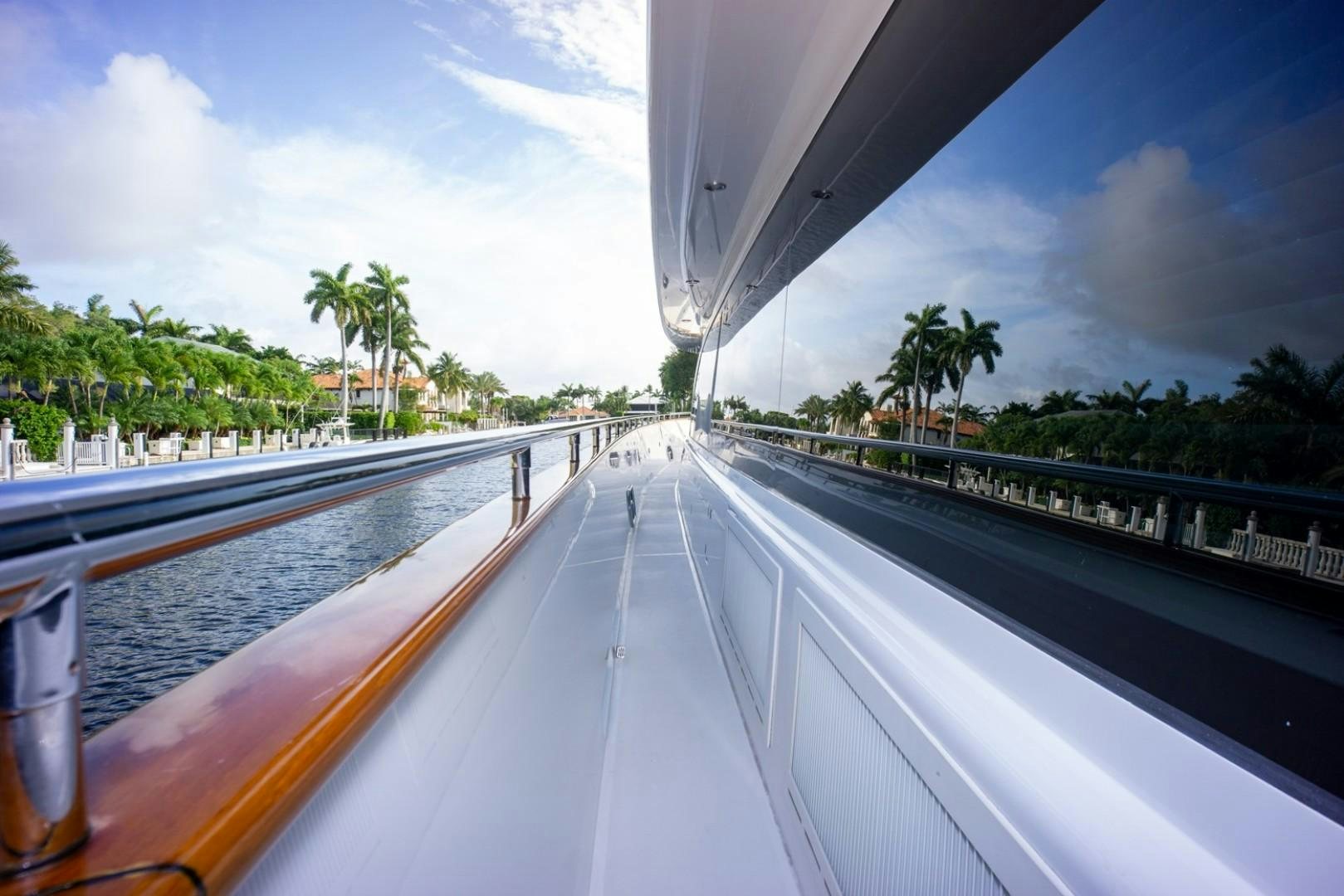 a long pool with a deck and trees aboard IN THE ZONE Yacht for Sale