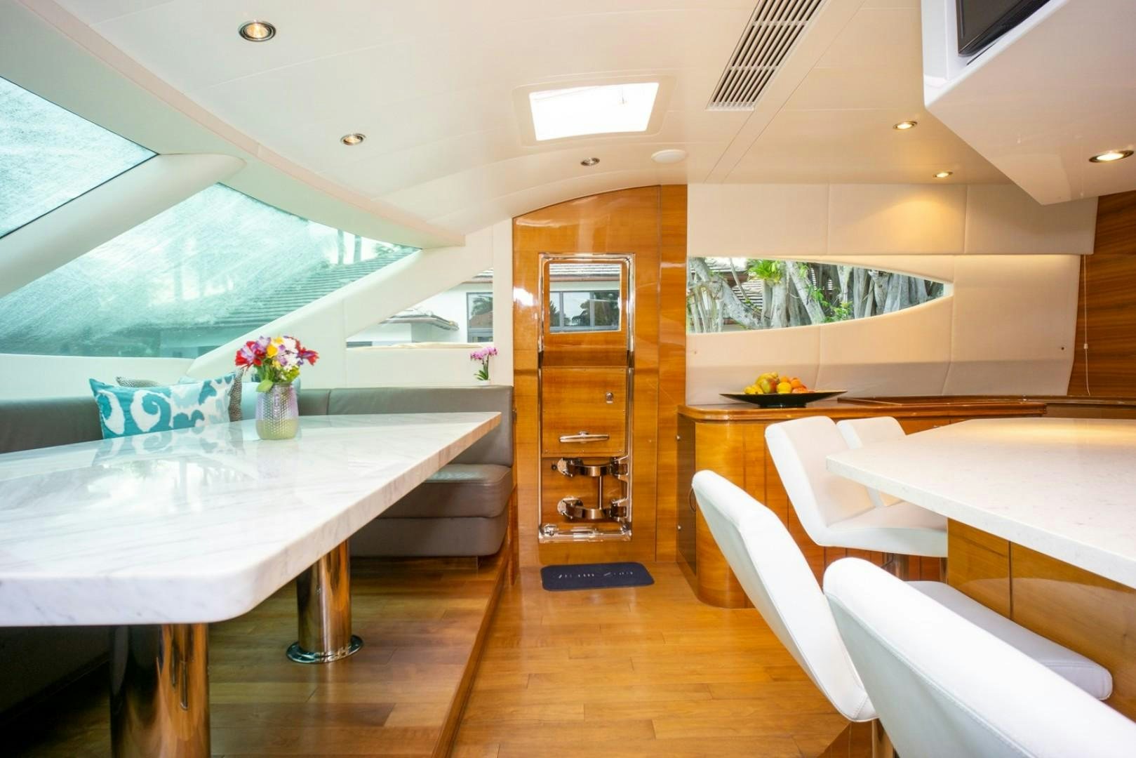 a room with a table and chairs aboard IN THE ZONE Yacht for Sale
