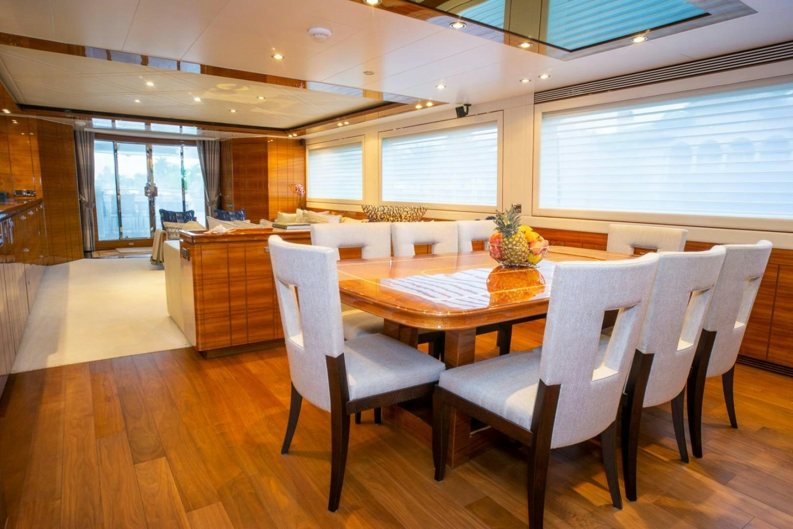 a room with tables and chairs aboard IN THE ZONE Yacht for Sale