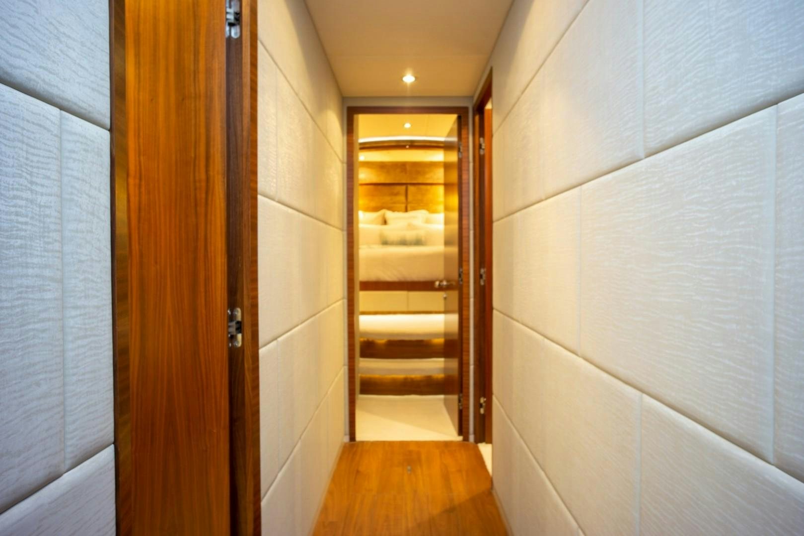 a hallway with a door and a wood door aboard IN THE ZONE Yacht for Sale