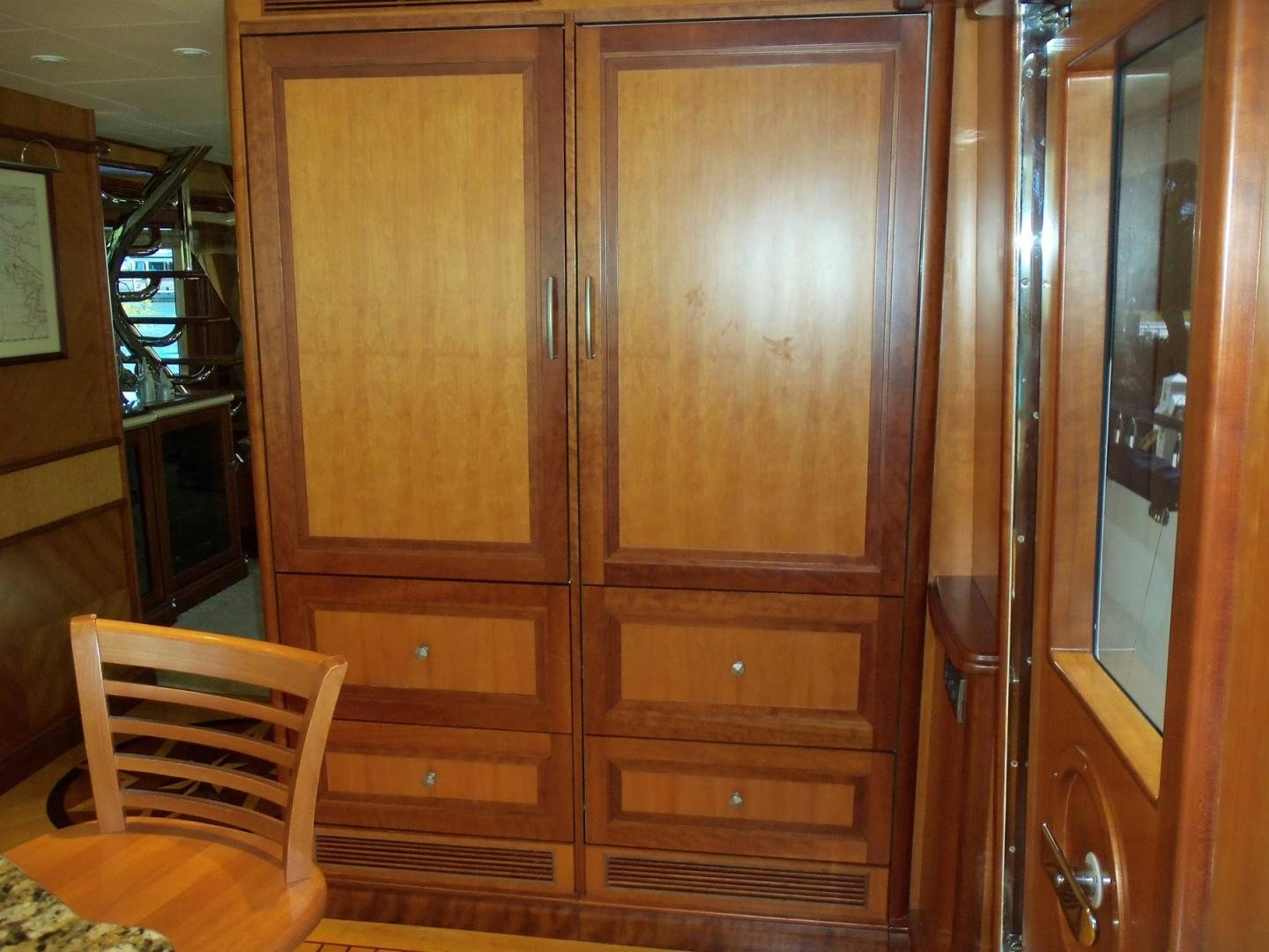 a wooden cabinet with drawers aboard MAGICAL DAYS Yacht for Sale