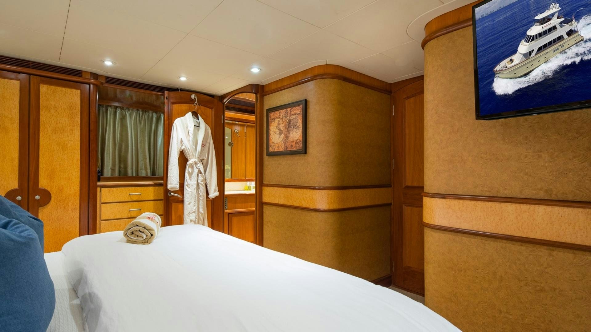 a bedroom with a closet and a bed aboard MAGICAL DAYS Yacht for Sale