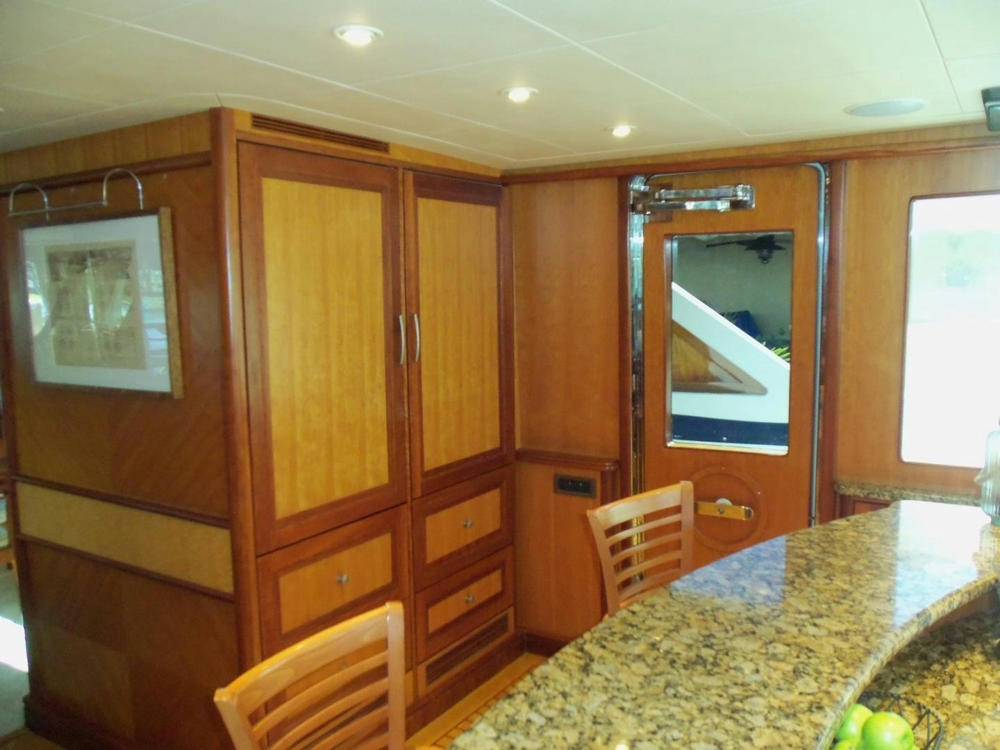 a room with a table and chairs aboard MAGICAL DAYS Yacht for Sale
