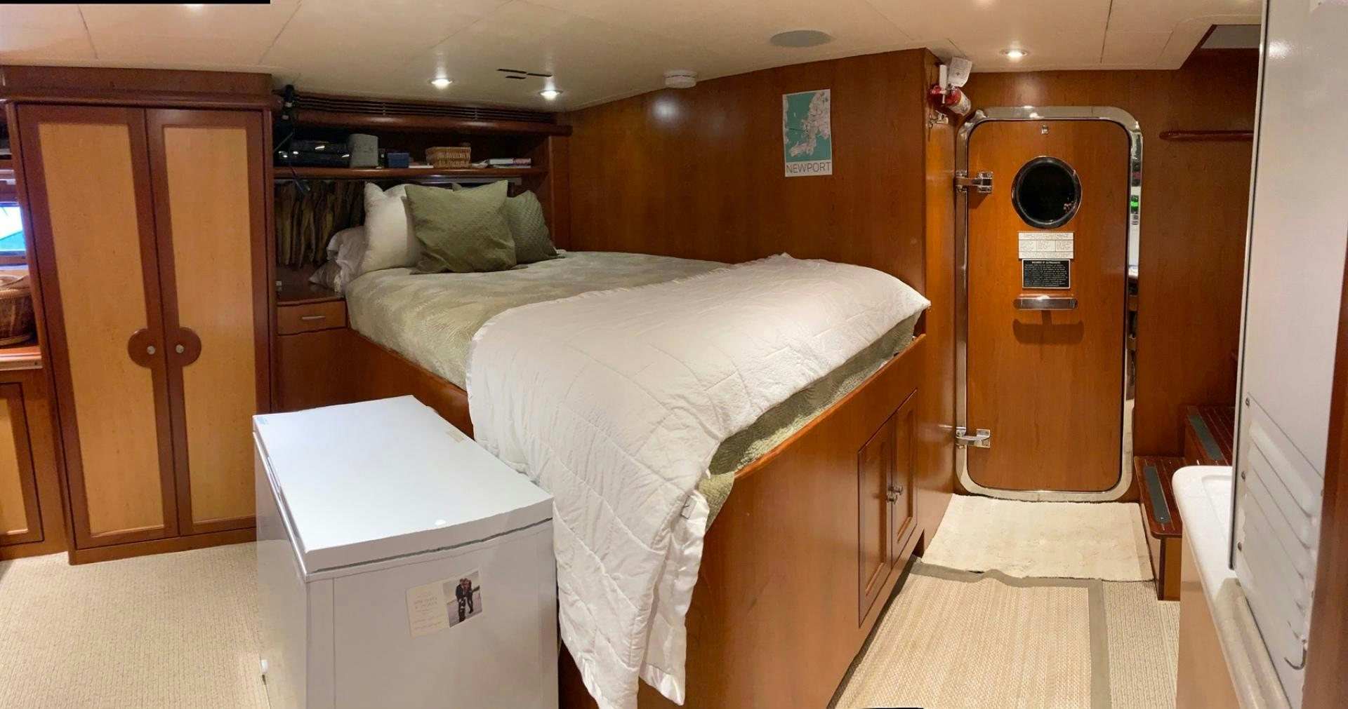 a room with a bed and a desk aboard MAGICAL DAYS Yacht for Sale