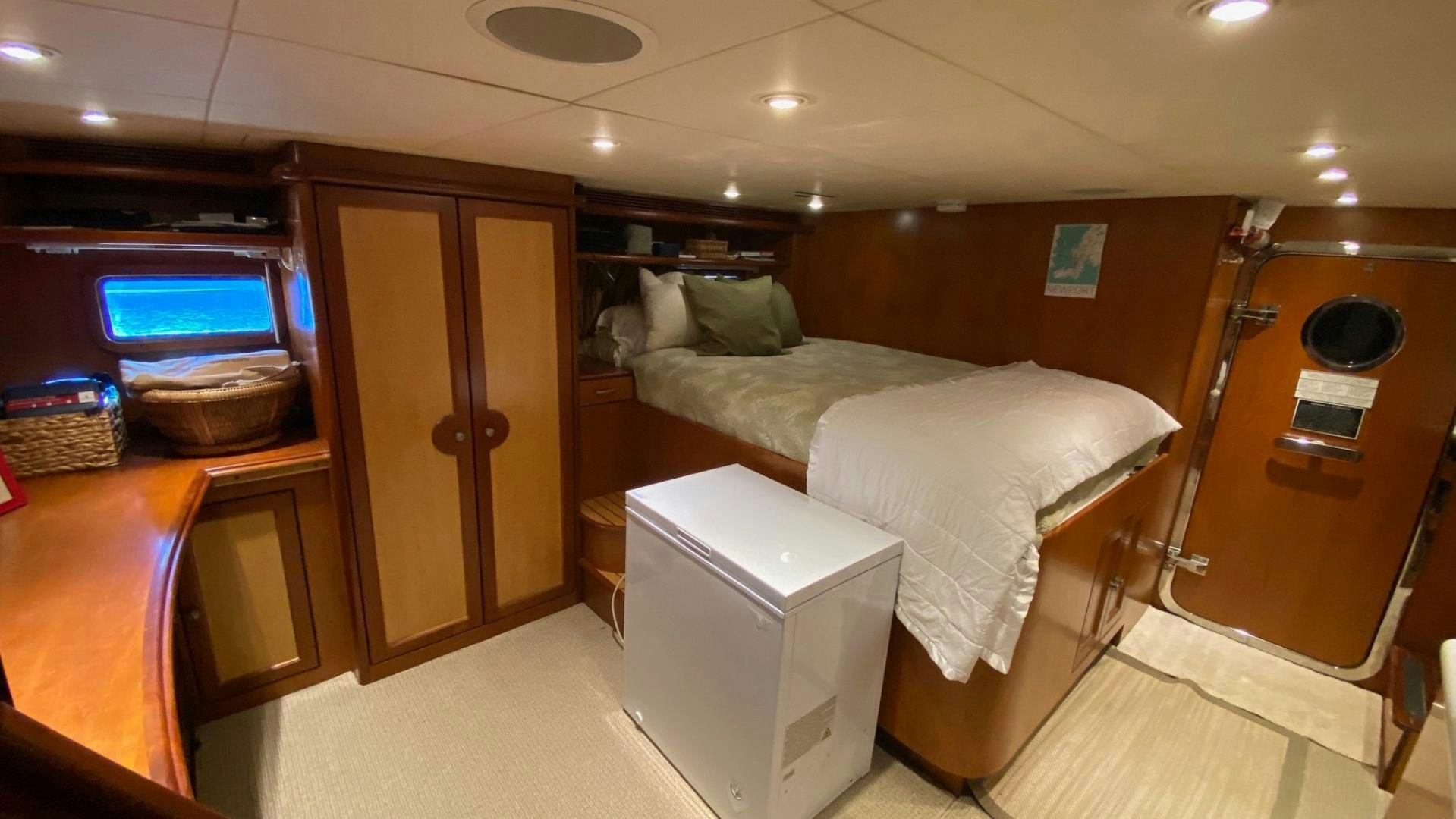 a room with a bed and a television aboard MAGICAL DAYS Yacht for Sale