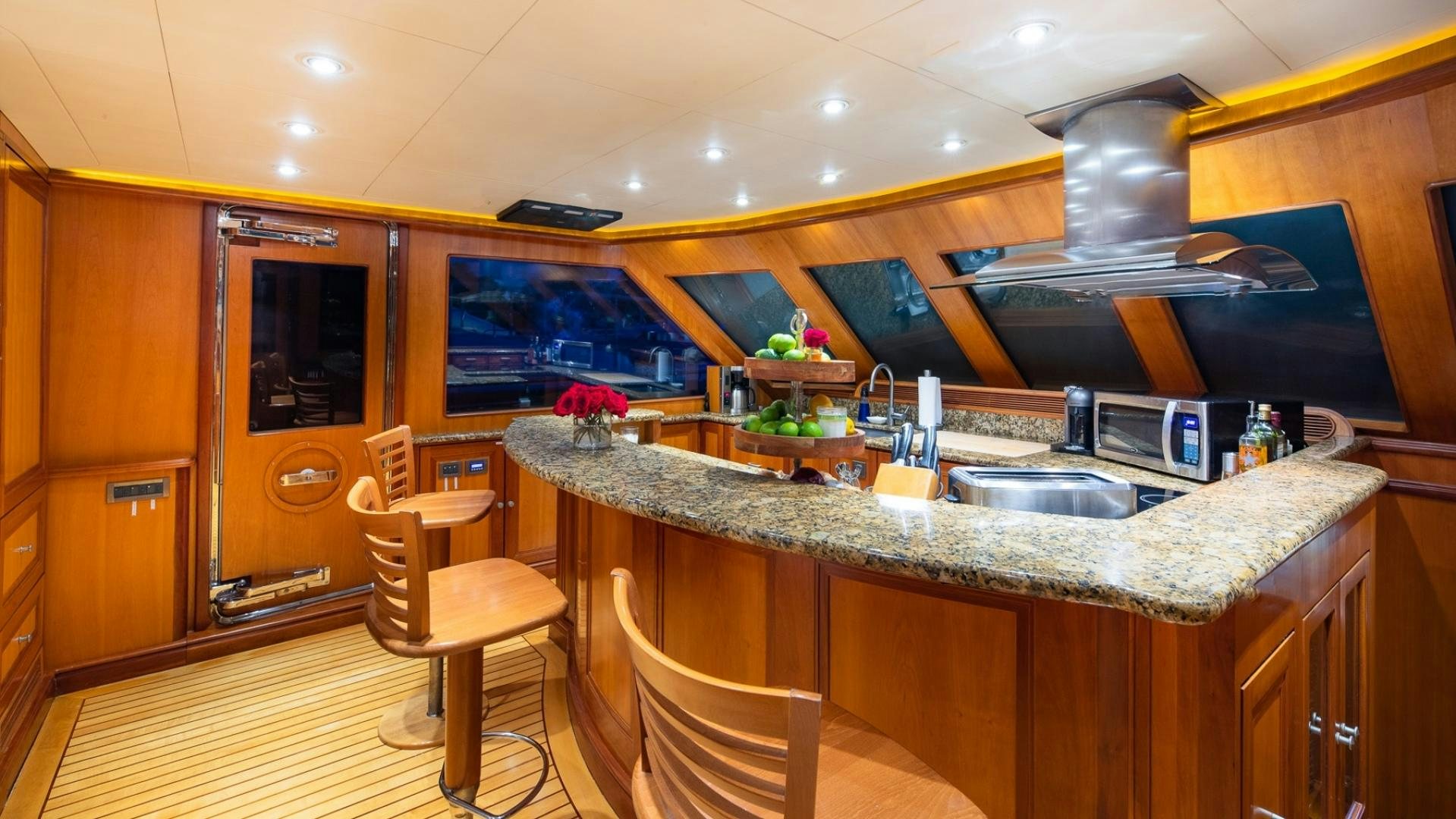 a kitchen with a large island aboard MAGICAL DAYS Yacht for Sale