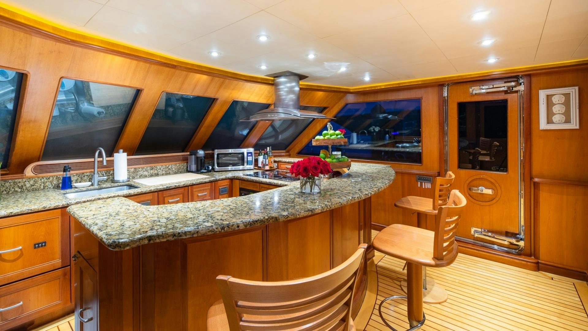 a kitchen with a large island aboard MAGICAL DAYS Yacht for Sale