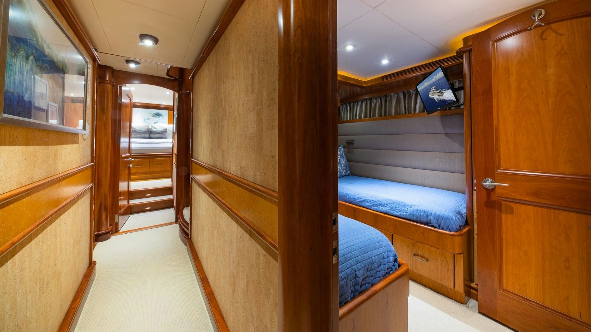 a room with a bed and a closet aboard MAGICAL DAYS Yacht for Sale