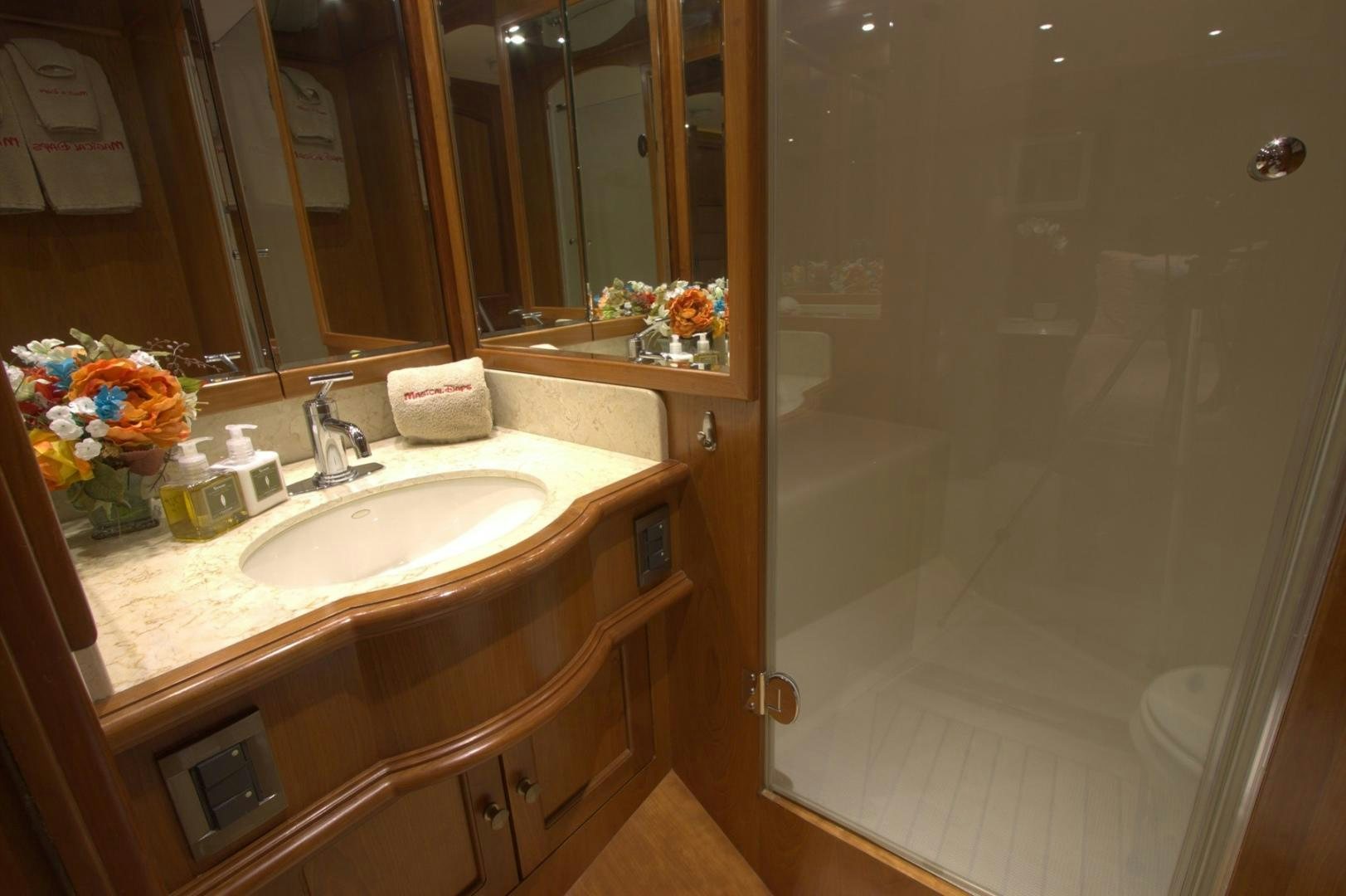 a bathroom with a sink and a shower aboard MAGICAL DAYS Yacht for Sale