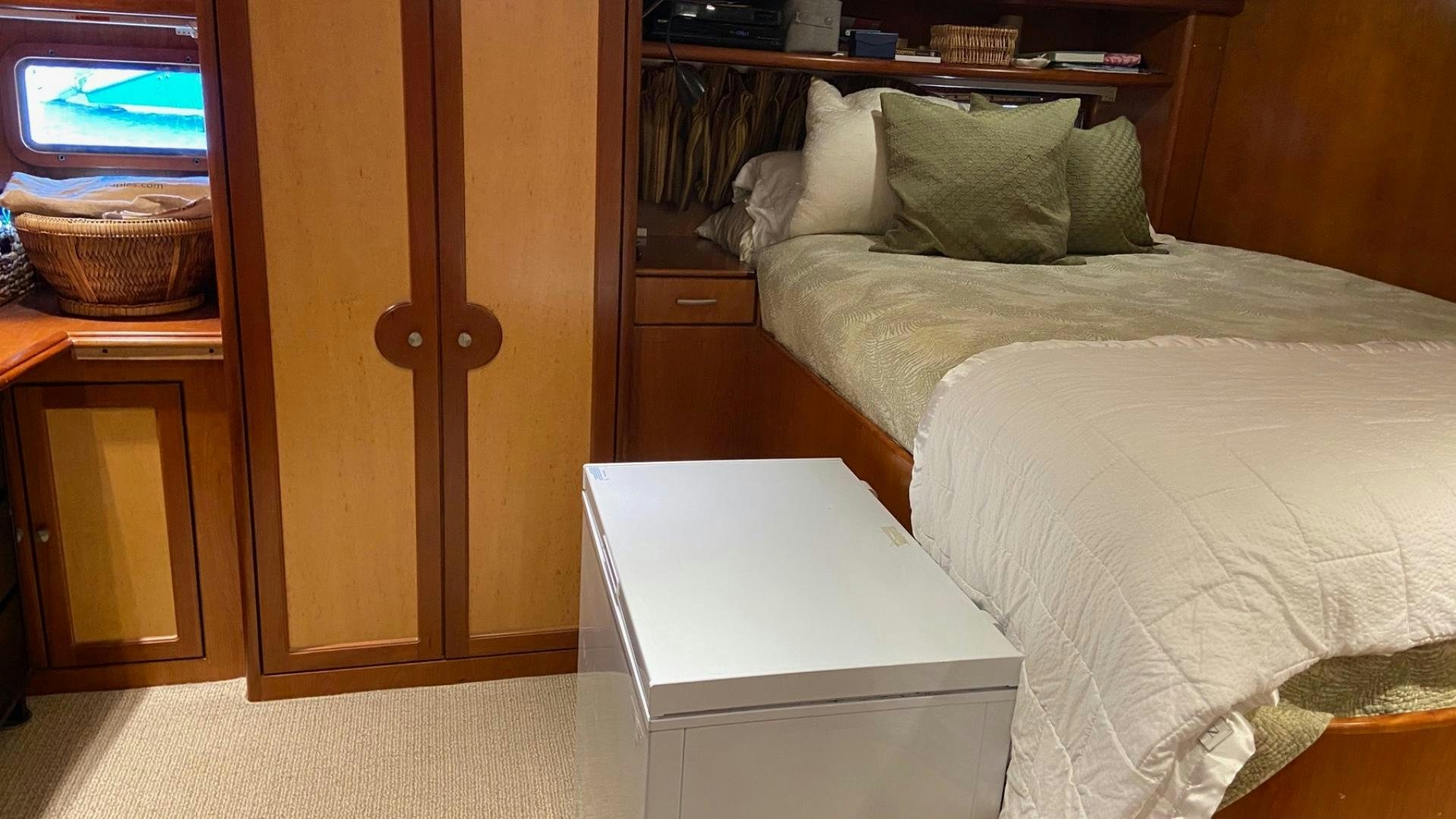 a bedroom with a bed and a desk aboard MAGICAL DAYS Yacht for Sale