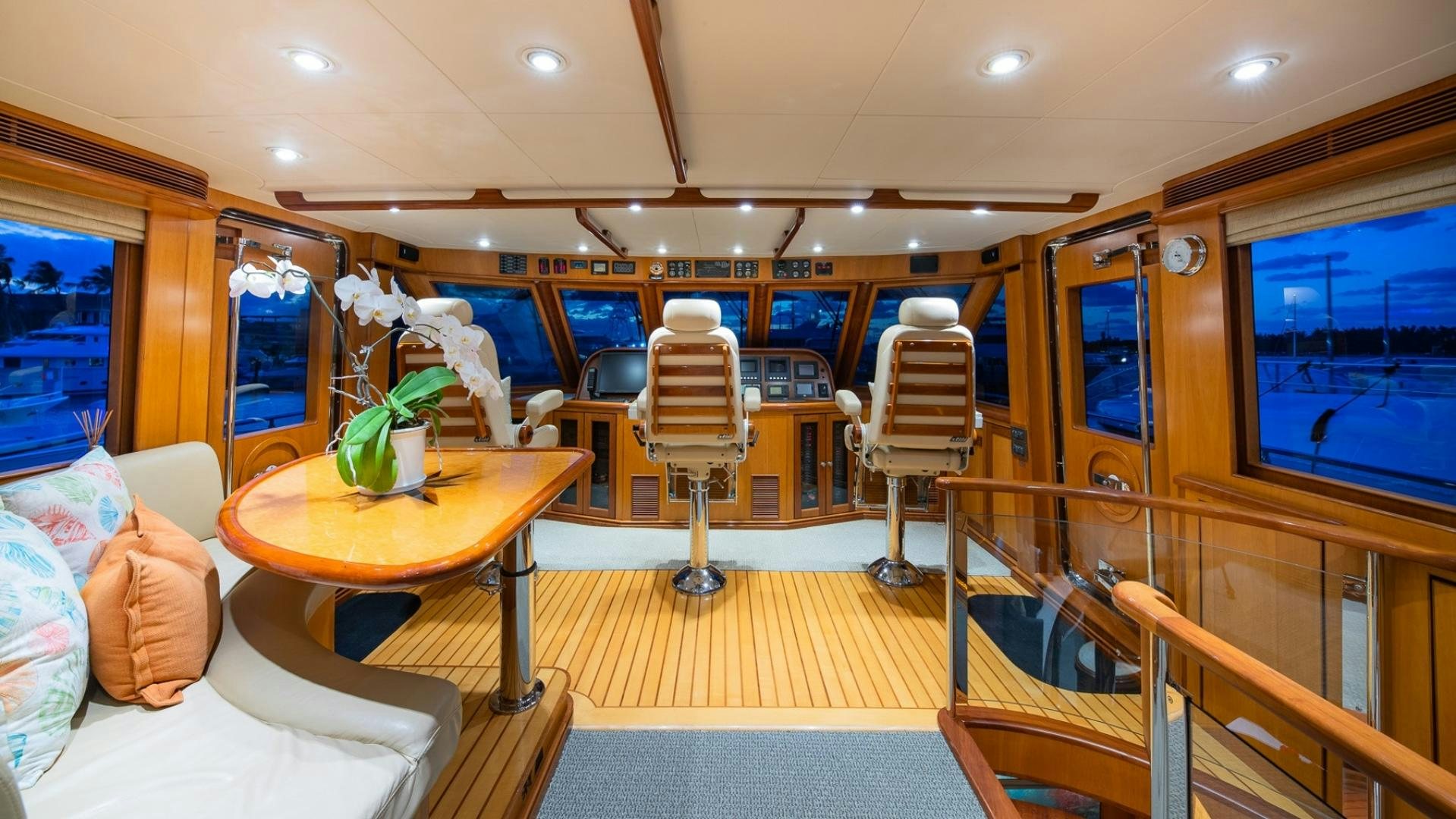 a room with a table chairs and a tv aboard MAGICAL DAYS Yacht for Sale