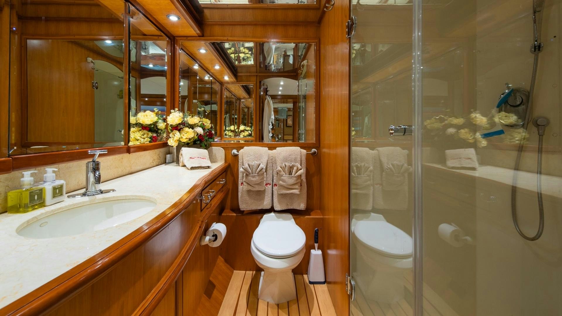 a bathroom with a glass shower aboard MAGICAL DAYS Yacht for Sale