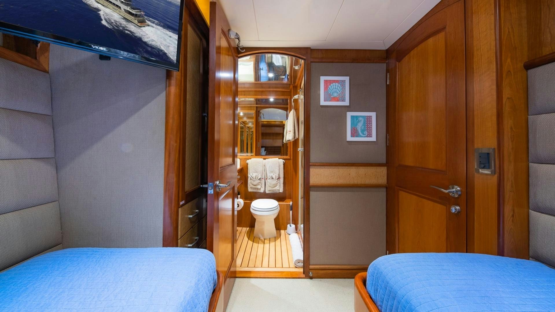 a room with a bed and a closet aboard MAGICAL DAYS Yacht for Sale