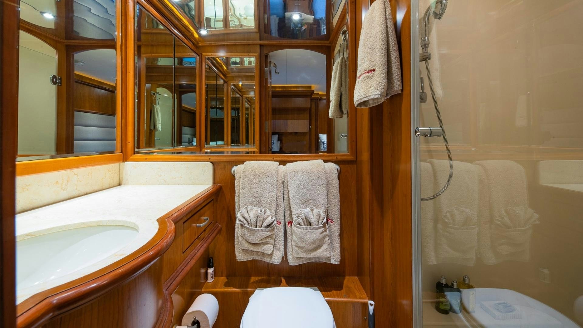 a bathroom with a bathtub and toilet aboard MAGICAL DAYS Yacht for Sale