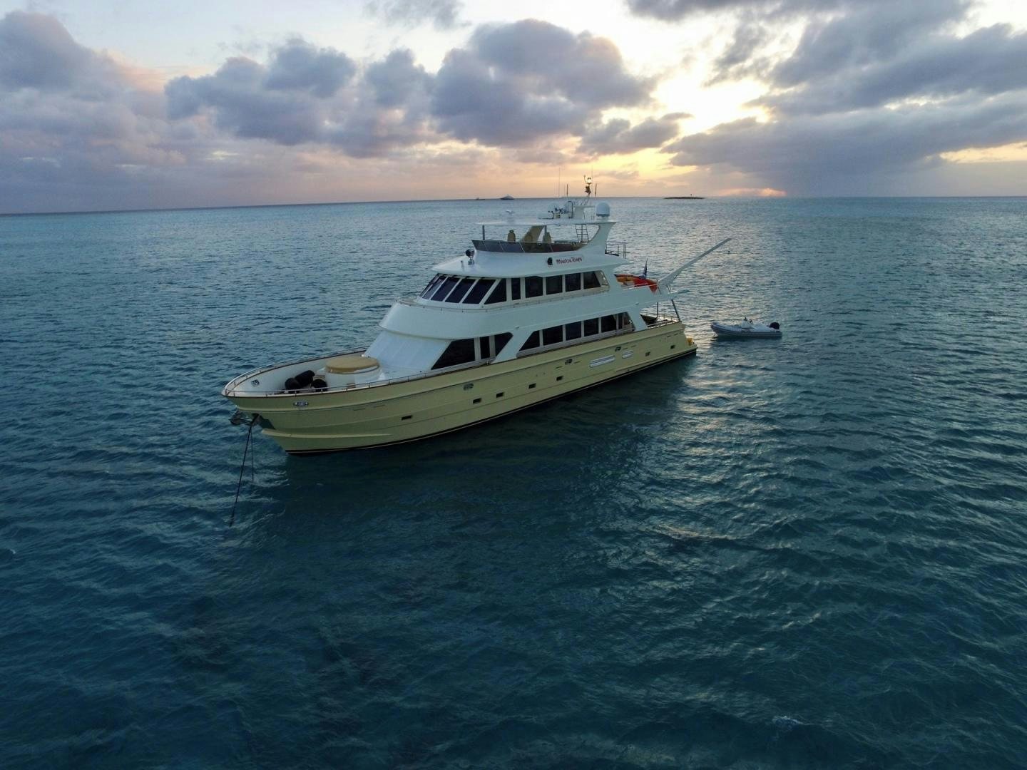 a white boat in the water aboard MAGICAL DAYS Yacht for Sale