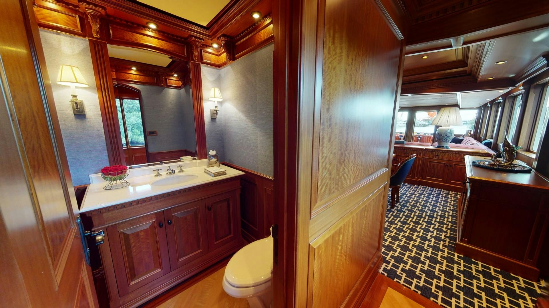 a bathroom with a sink and cabinets aboard PATRIOT Yacht for Sale