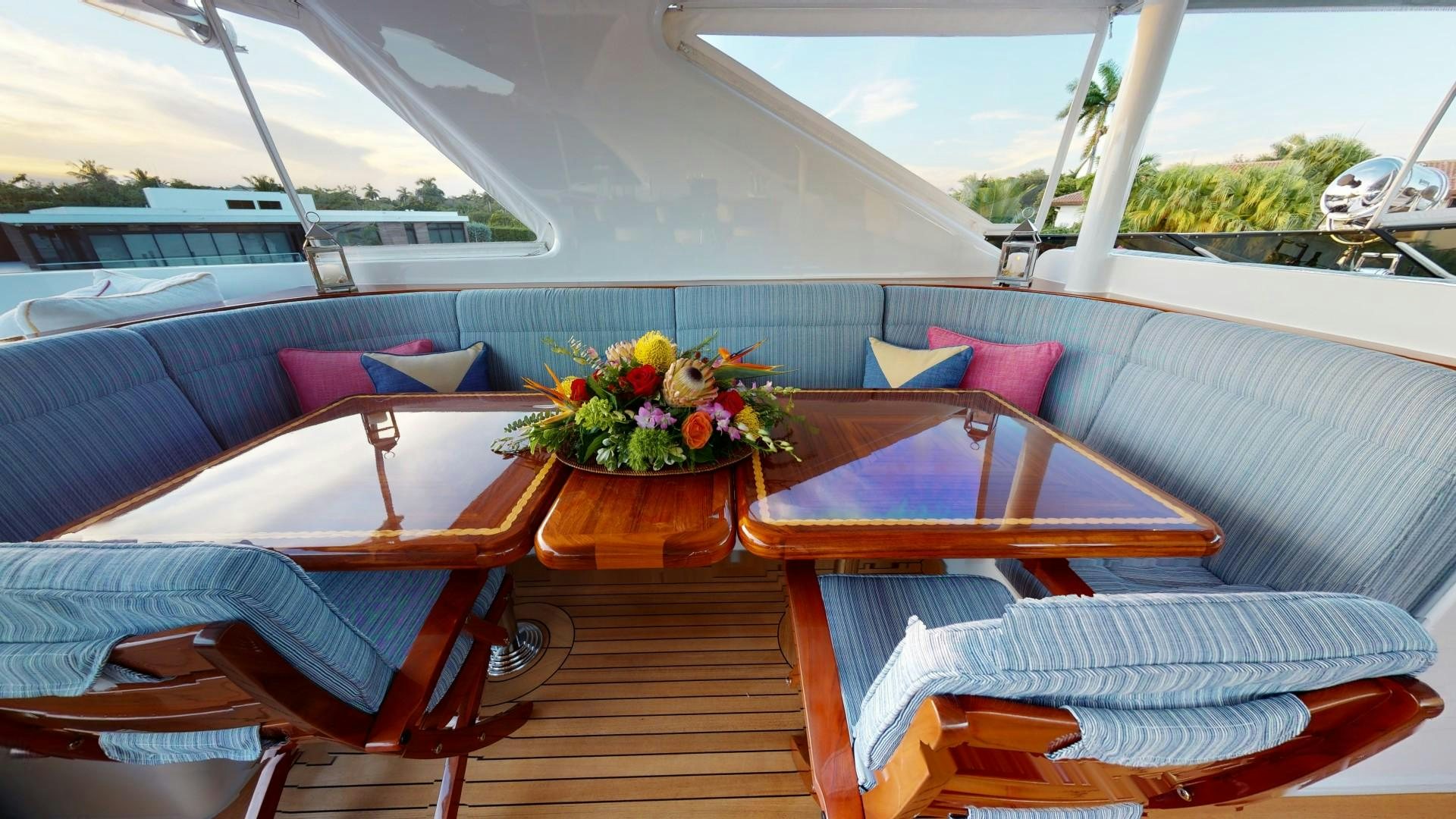 a boat with flowers on the deck aboard PATRIOT Yacht for Sale