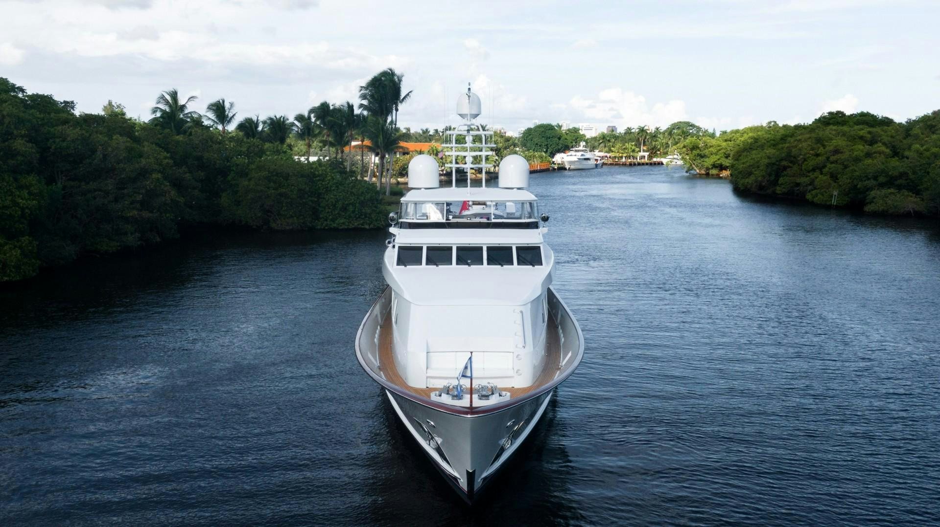 a white boat in the water aboard PATRIOT Yacht for Sale