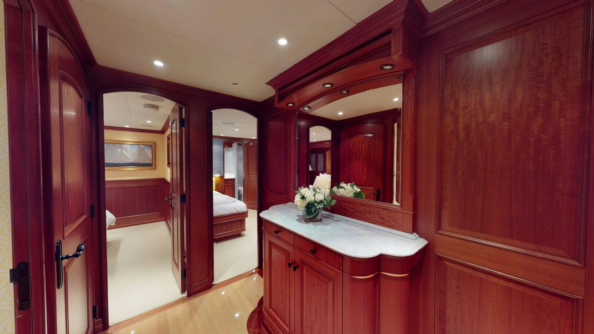 a bathroom with a countertop sink and a mirror aboard PATRIOT Yacht for Sale