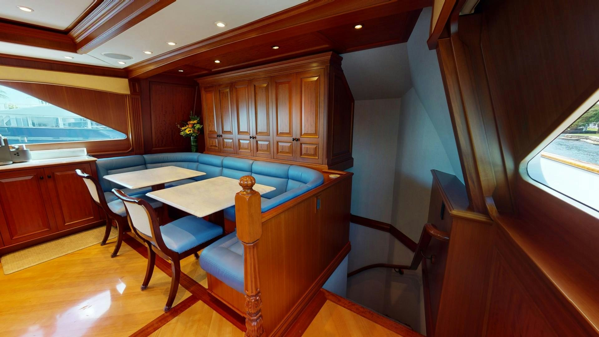 a room with a table and chairs aboard PATRIOT Yacht for Sale
