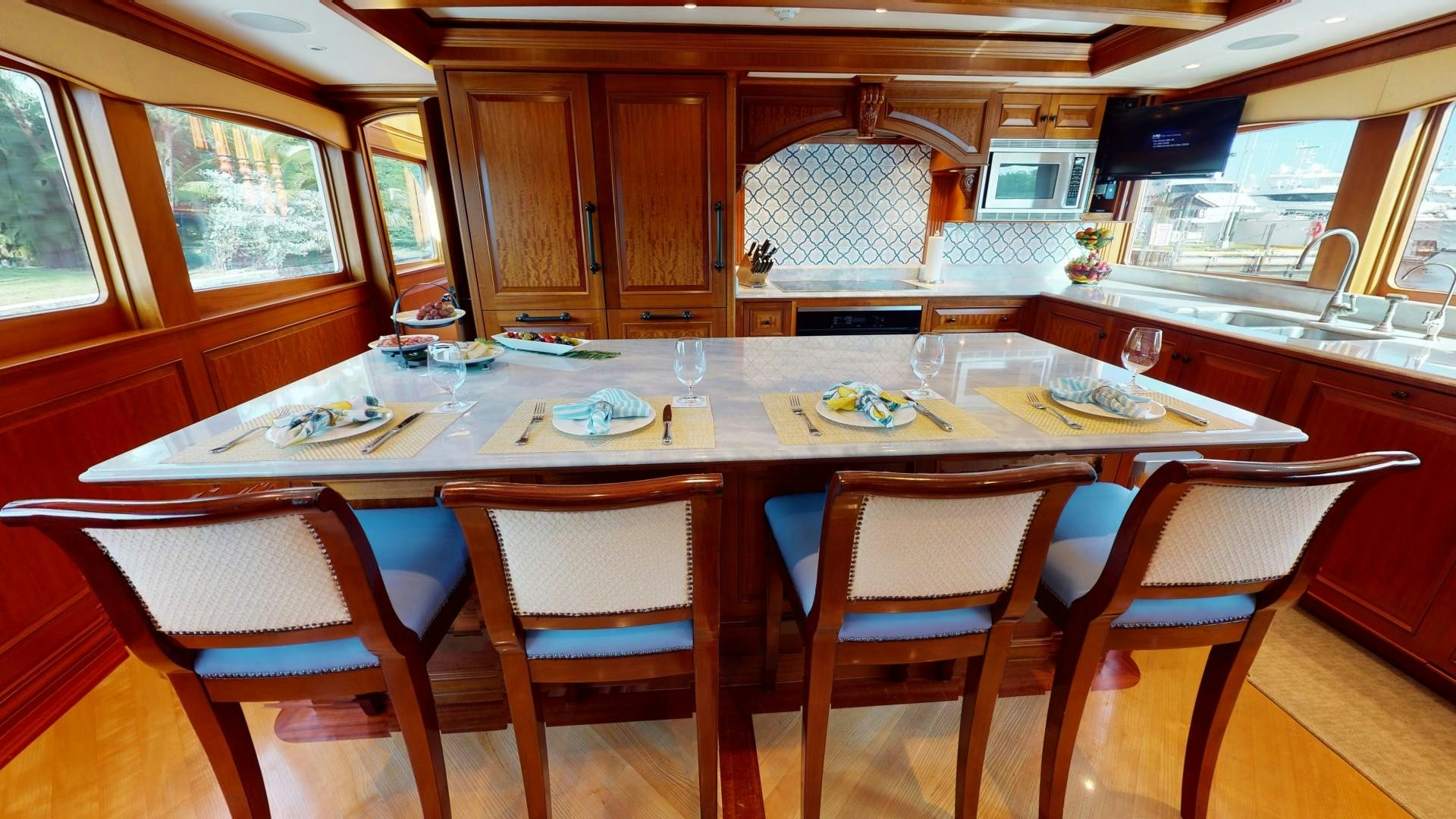 a kitchen with a dining table aboard PATRIOT Yacht for Sale