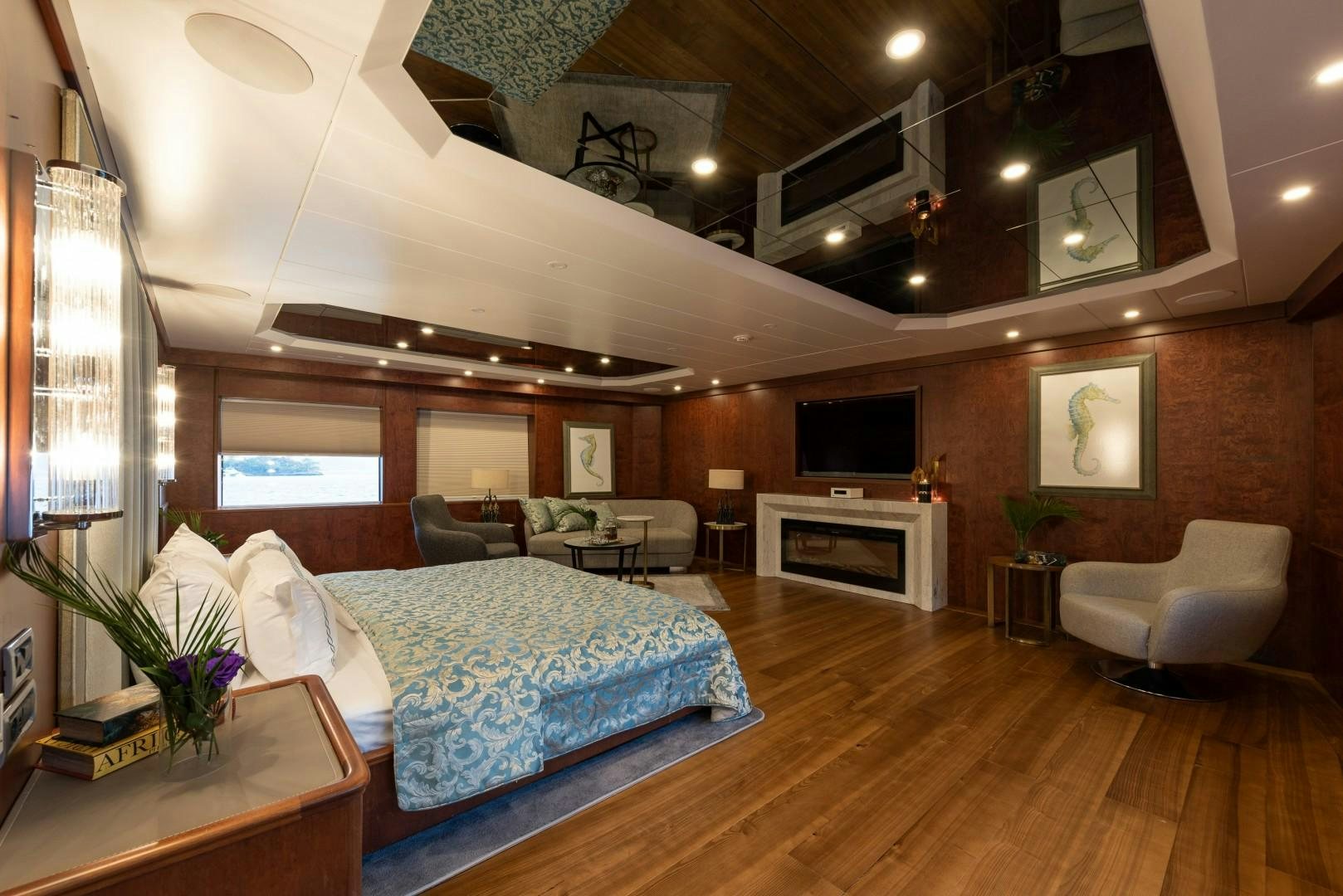 a bedroom with a bed and a couch aboard OCEAN BREEZE Yacht for Sale