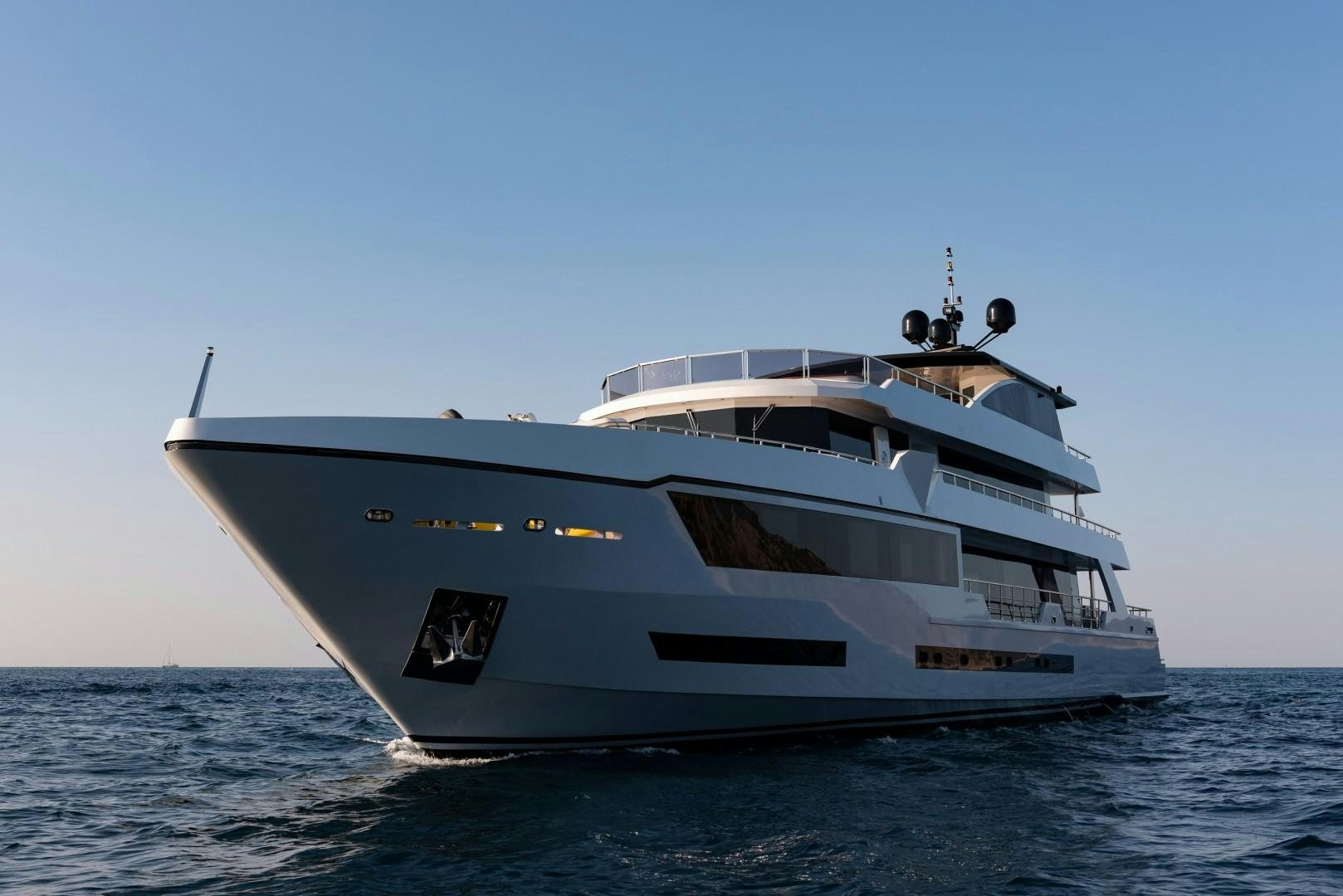 a large white yacht in the water aboard OCEAN BREEZE Yacht for Sale