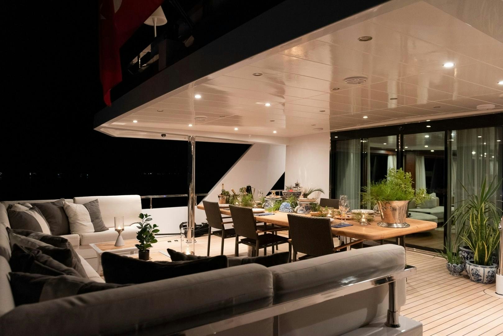 a room with a table and chairs aboard OCEAN BREEZE Yacht for Sale