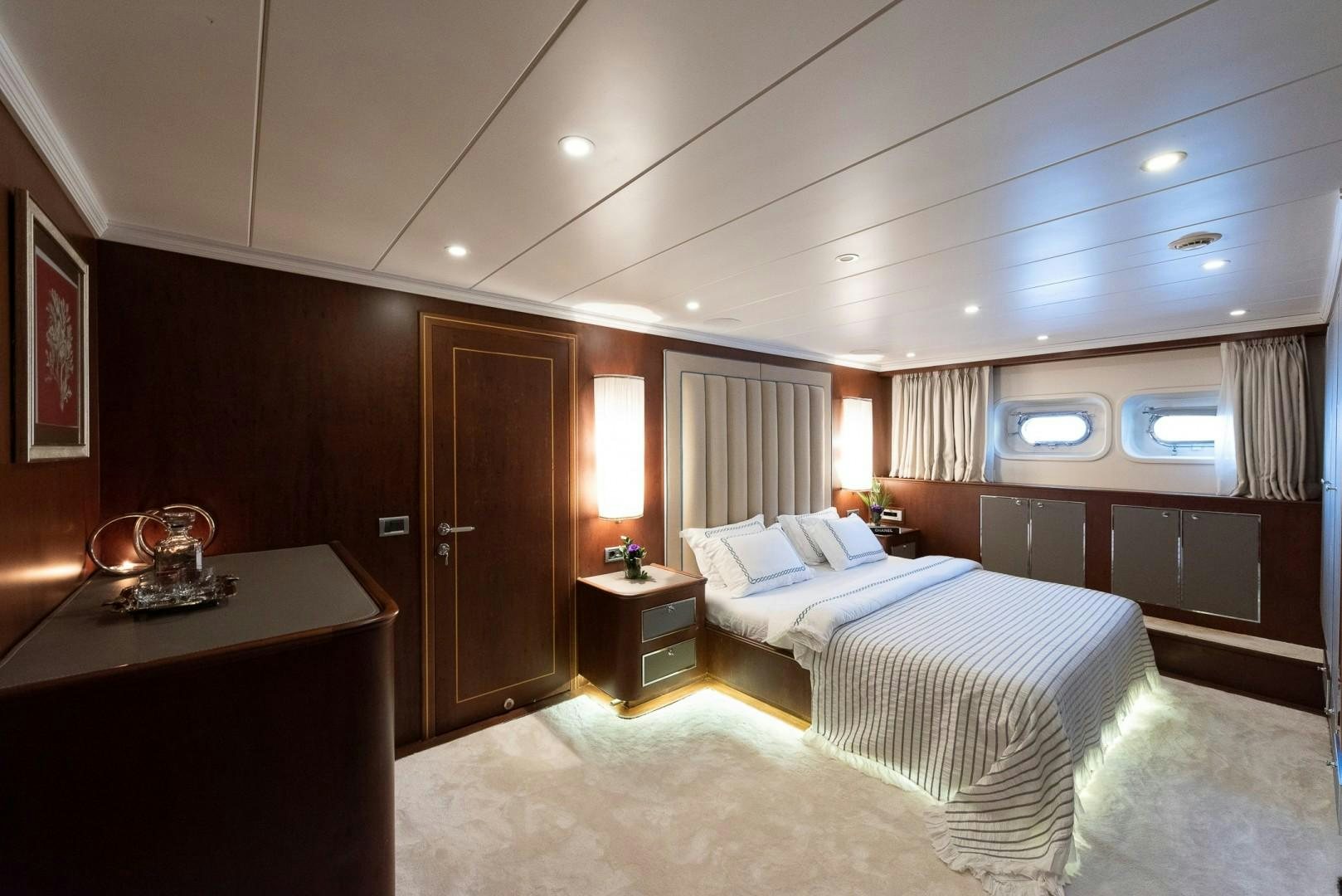 a bedroom with a couple of beds aboard OCEAN BREEZE Yacht for Sale