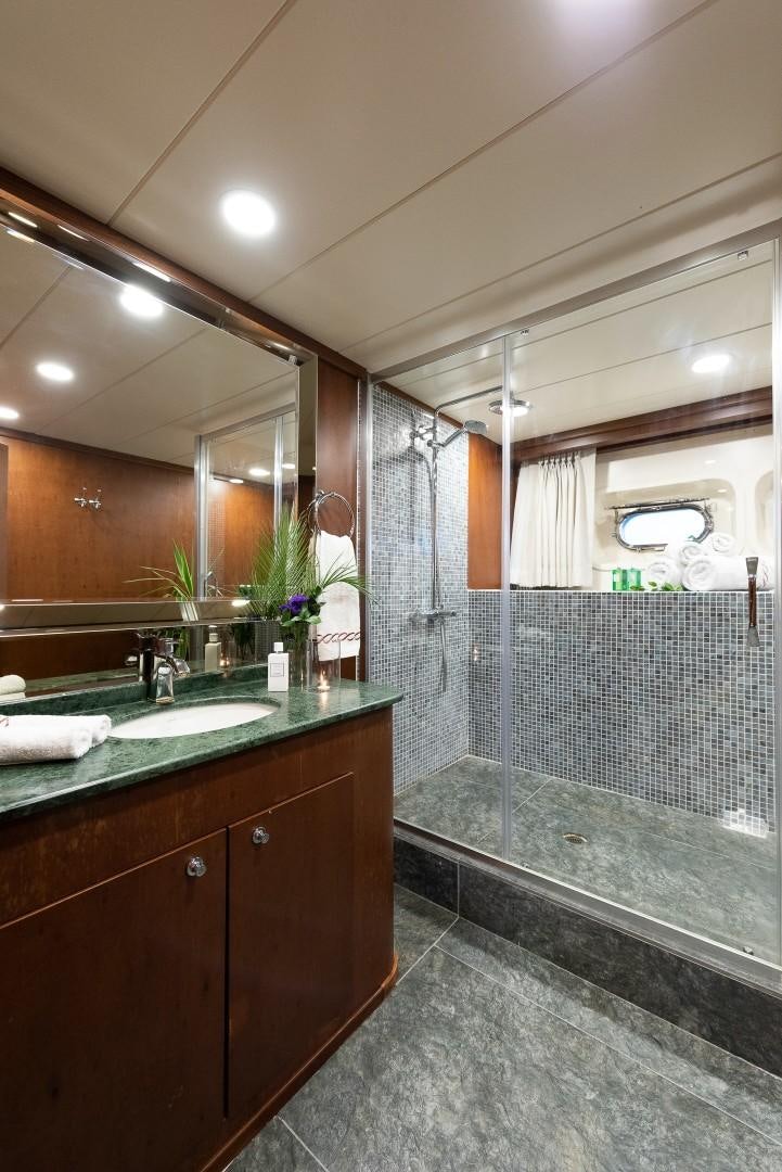 a bathroom with a large mirror aboard OCEAN BREEZE Yacht for Sale