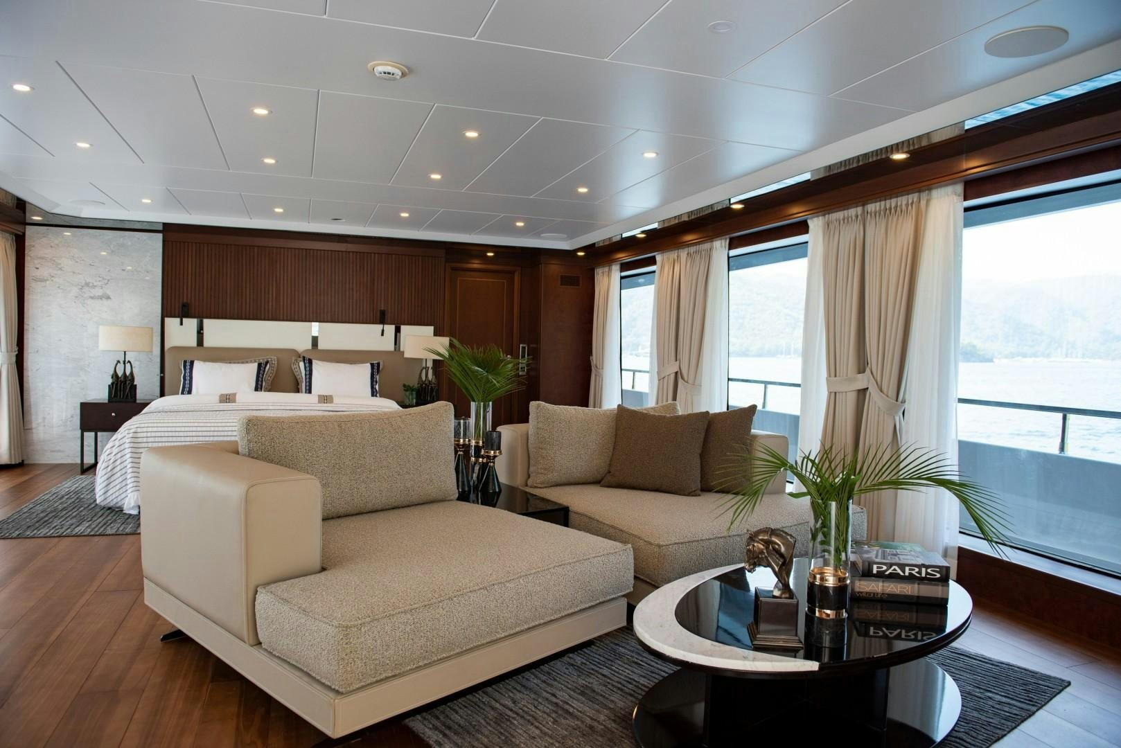 a living room with a couch and a coffee table aboard OCEAN BREEZE Yacht for Sale