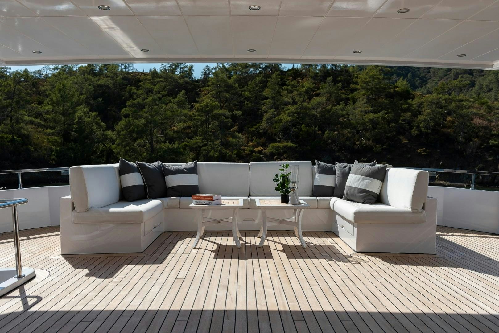 a room with couches and a table aboard OCEAN BREEZE Yacht for Sale