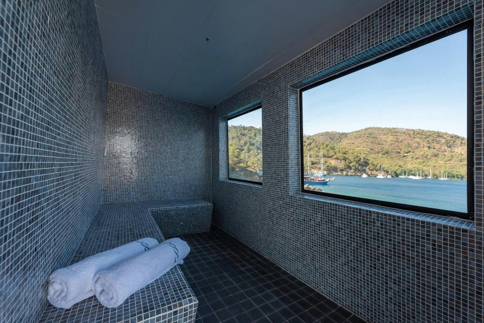 a room with a bed and a window aboard OCEAN BREEZE Yacht for Sale