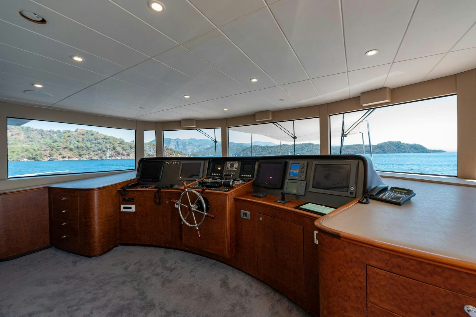 a room with computers and monitors aboard OCEAN BREEZE Yacht for Sale