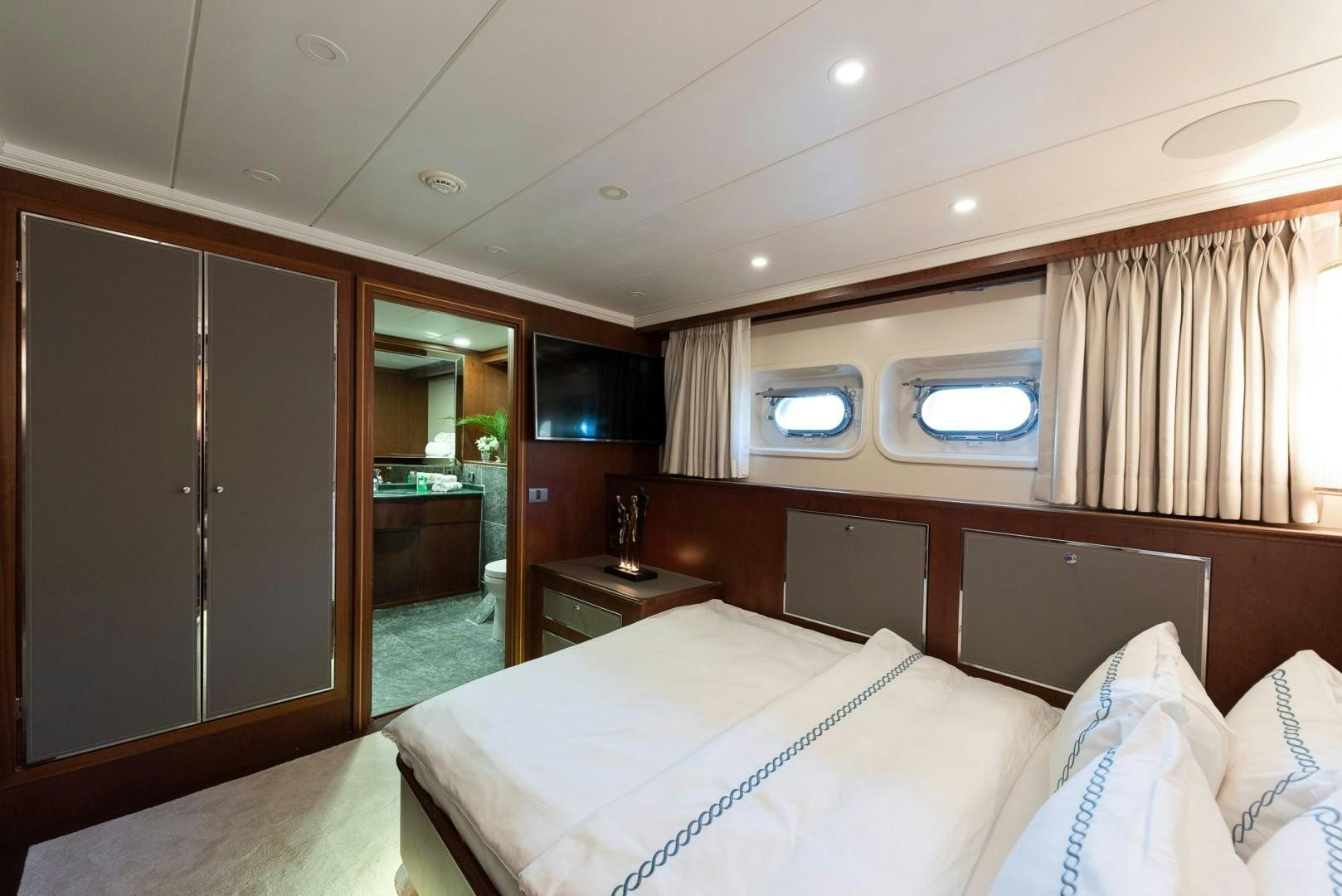 a hotel room with a bed aboard OCEAN BREEZE Yacht for Sale