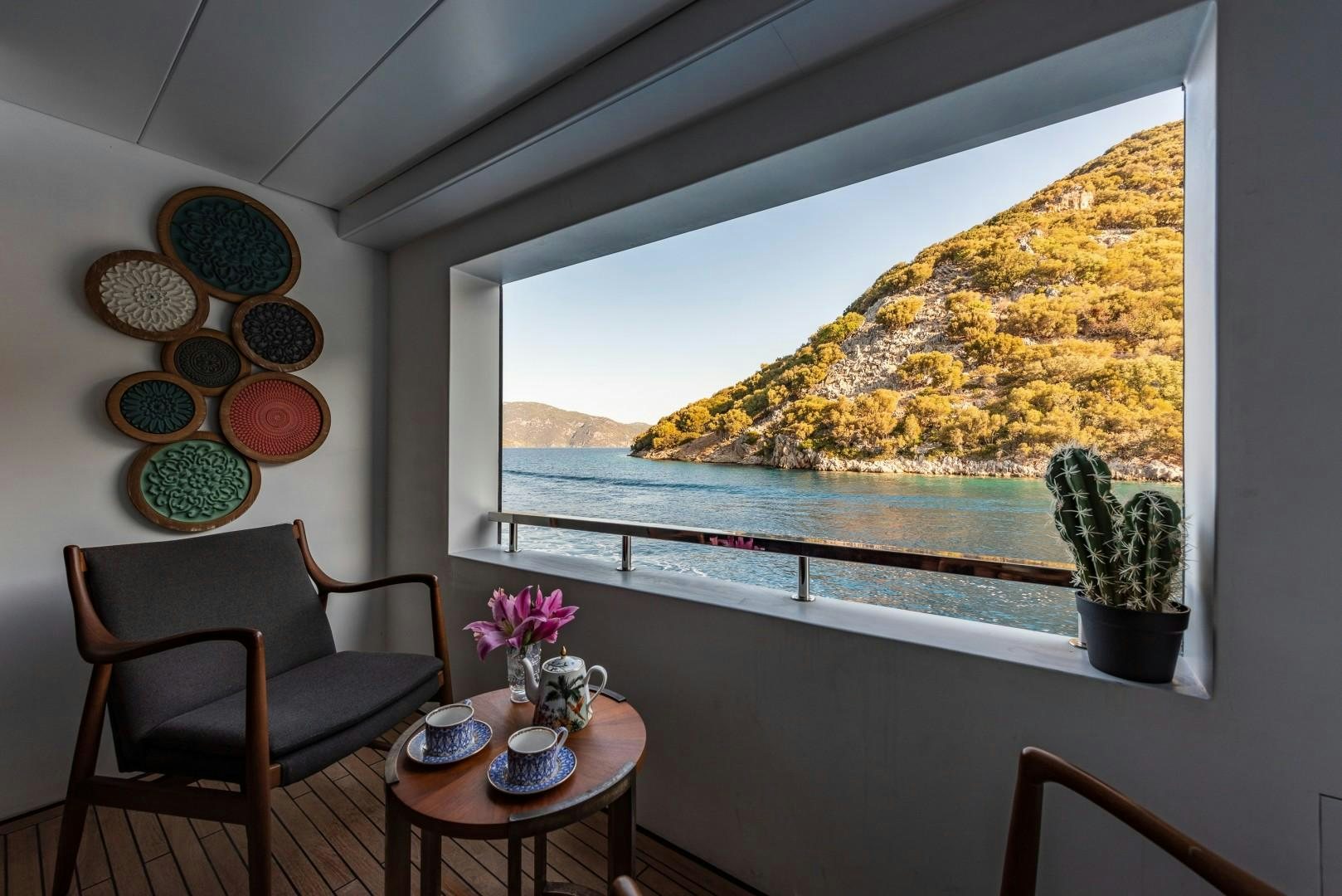 a table and chairs in a room aboard OCEAN BREEZE Yacht for Sale