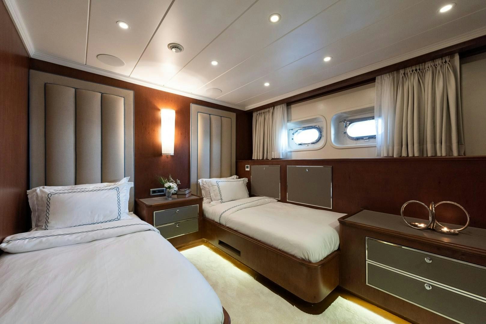 a room with two beds aboard OCEAN BREEZE Yacht for Sale