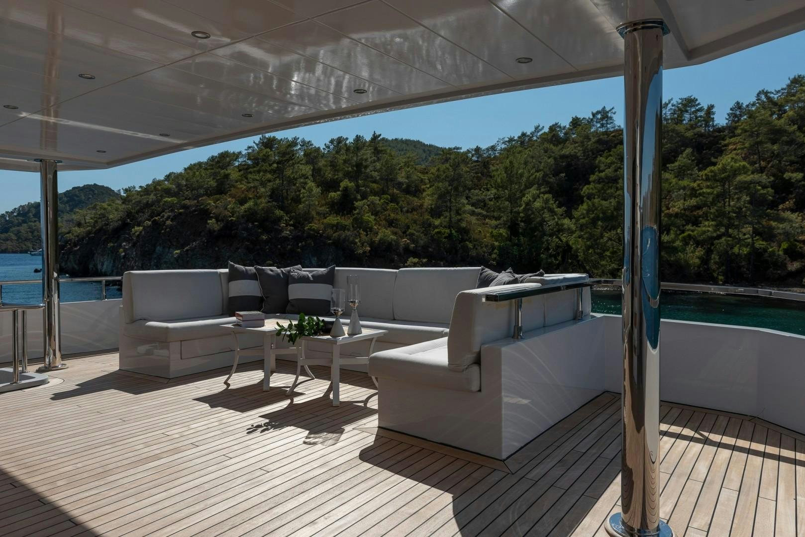 a patio with a large glass window aboard OCEAN BREEZE Yacht for Sale