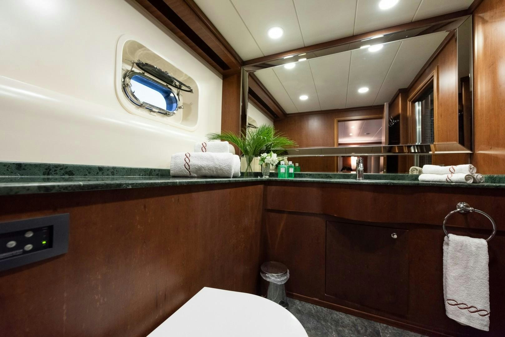 a bathroom with a sink and a mirror aboard OCEAN BREEZE Yacht for Sale