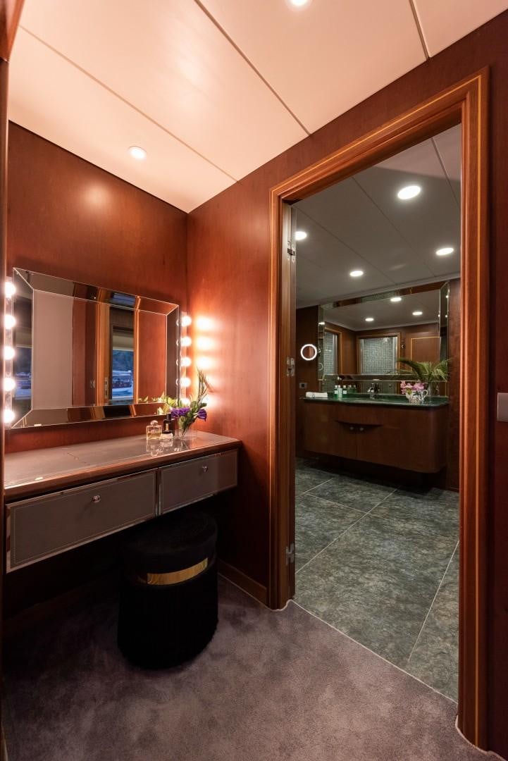a bathroom with a large mirror aboard OCEAN BREEZE Yacht for Sale