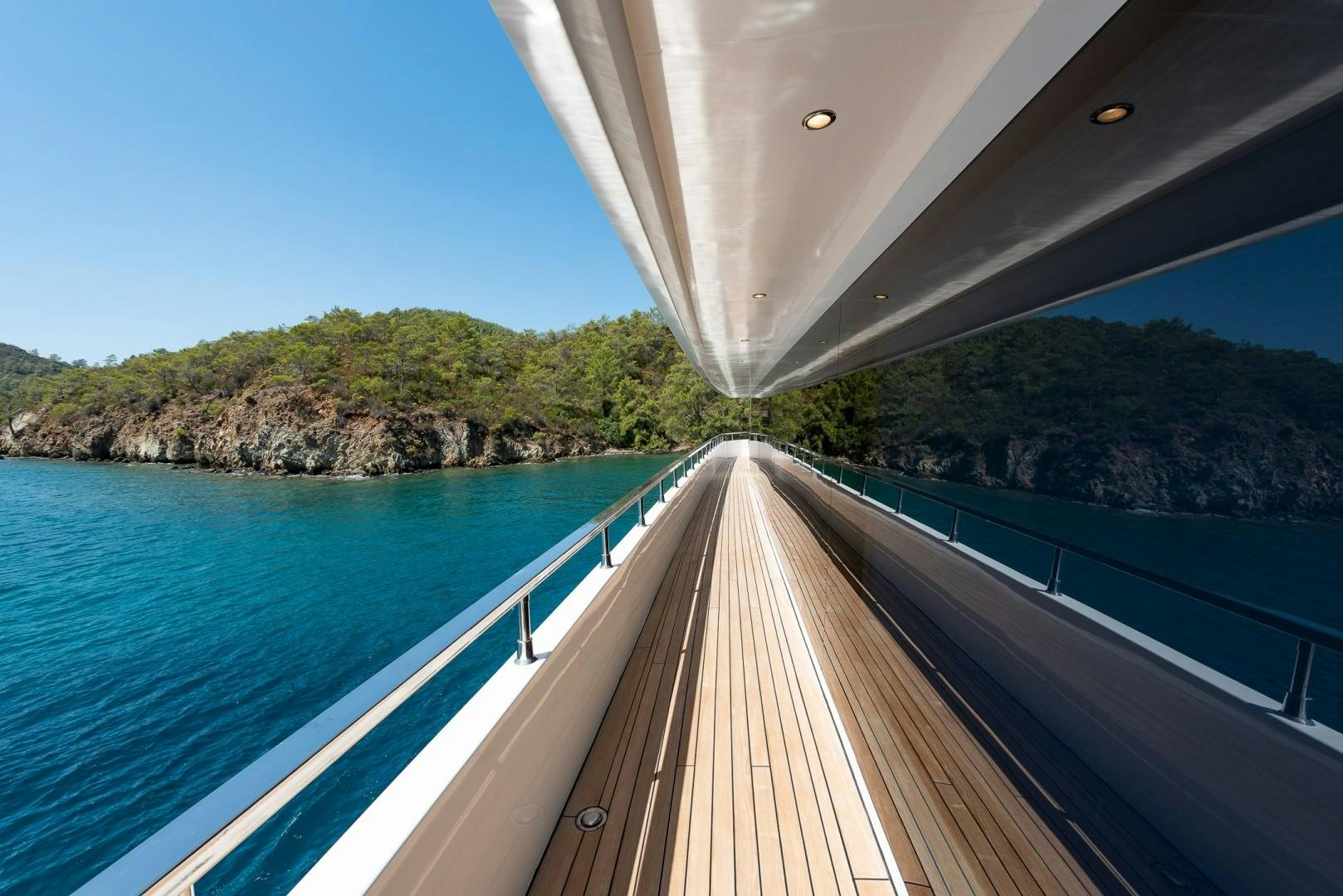 a wooden bridge over a body of water aboard OCEAN BREEZE Yacht for Sale