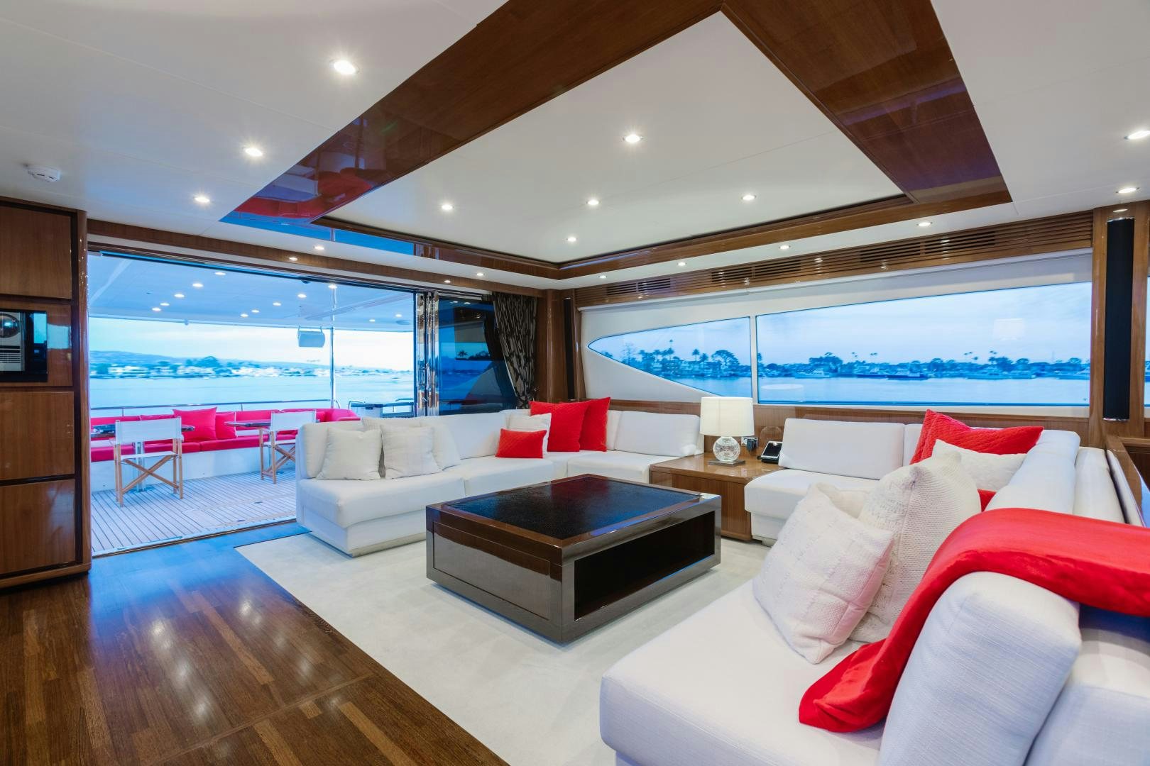 a modern living room with a large glass window aboard LOVE N LIFE Yacht for Sale