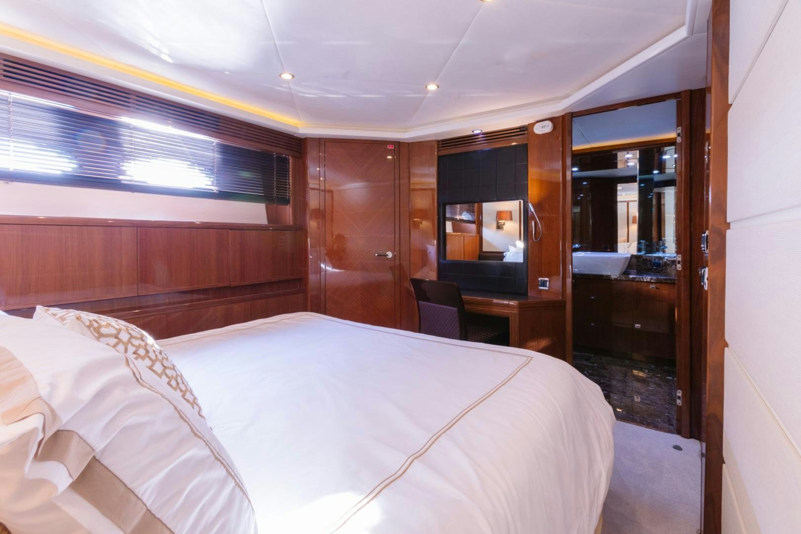 a room with a bed and a wood door aboard LOVE N LIFE Yacht for Sale