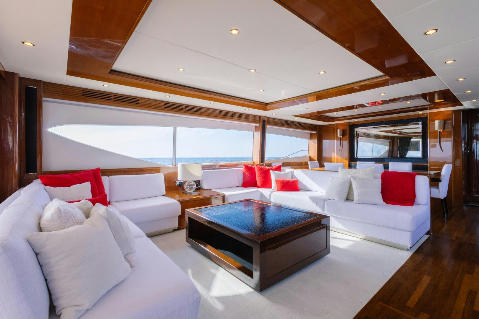 a large living room with white couches and a large window aboard LOVE N LIFE Yacht for Sale