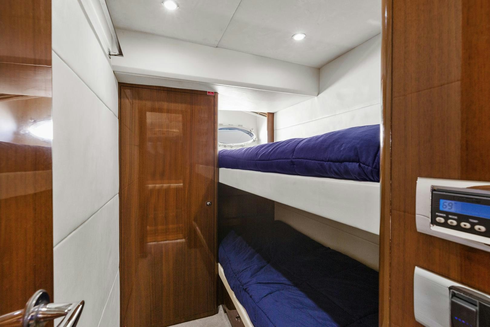 a room with a bed and a desk aboard LOVE N LIFE Yacht for Sale