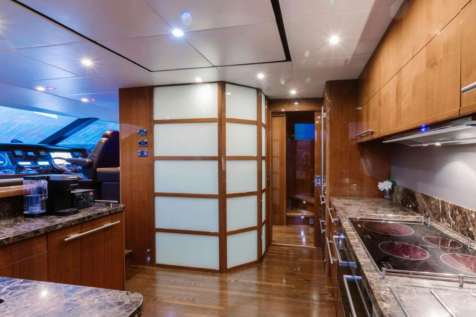 a kitchen with wooden cabinets aboard LOVE N LIFE Yacht for Sale